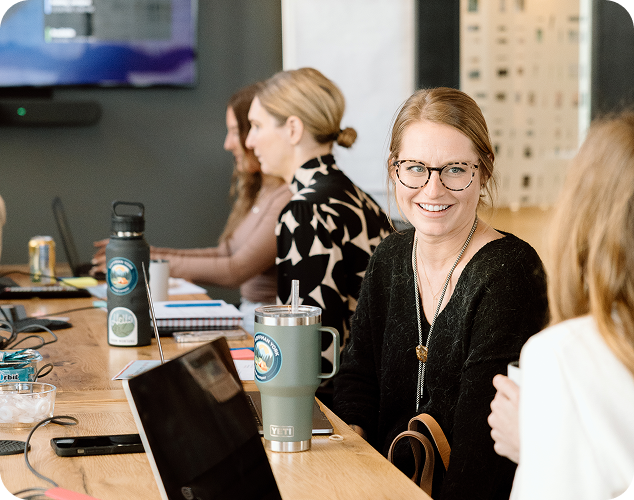 A small business owner chats with Hoffman York employees during a brand strategy session in Milwaukee.
