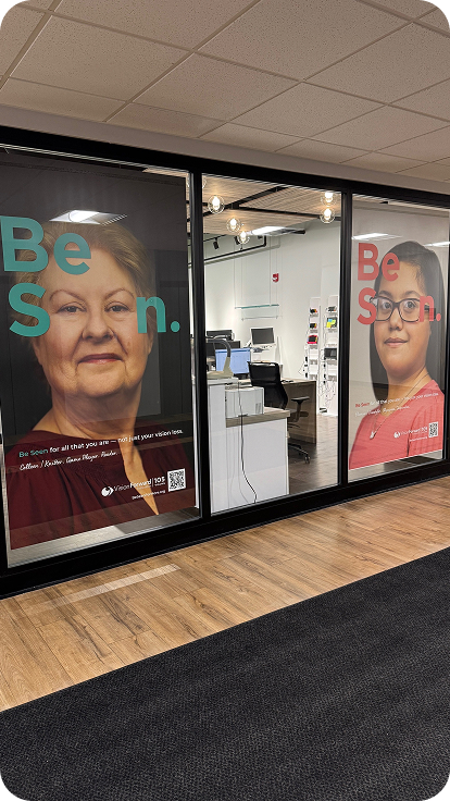 Two large Be Seen posters in an office setting.