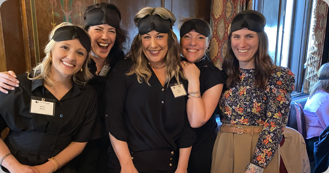 Five Hoffman York team members wearing blindfolds at Vision Forward's Dining in the Dark event.