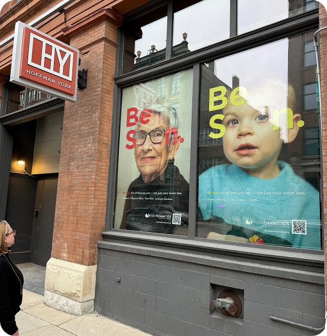 Two large Be Seen posters at the Hoffman York office in Milwaukee.